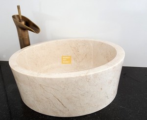 Lavabo con rodillo de mármol beige